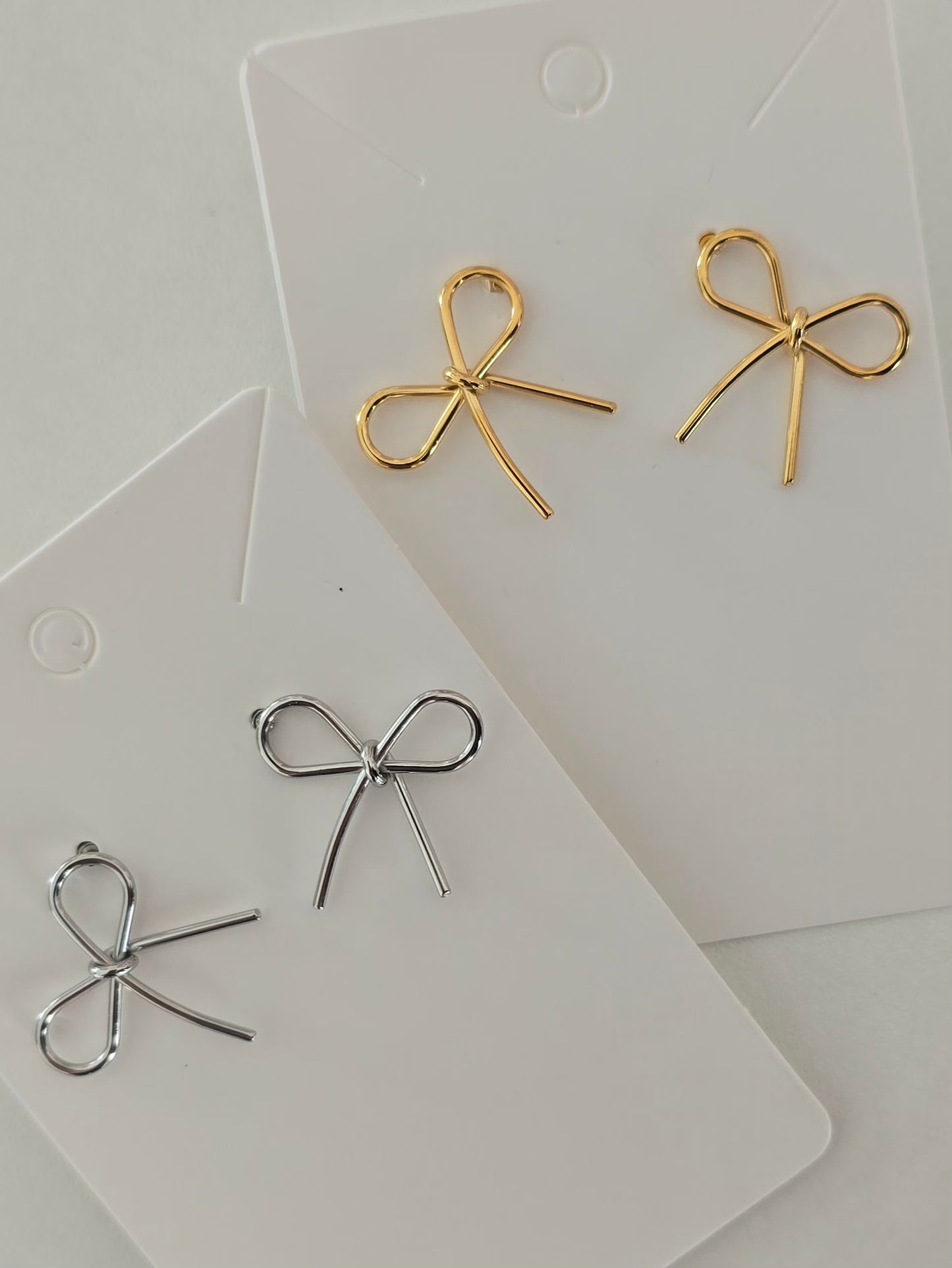Boucles d'oreilles en acier inoxydable petit noeuds