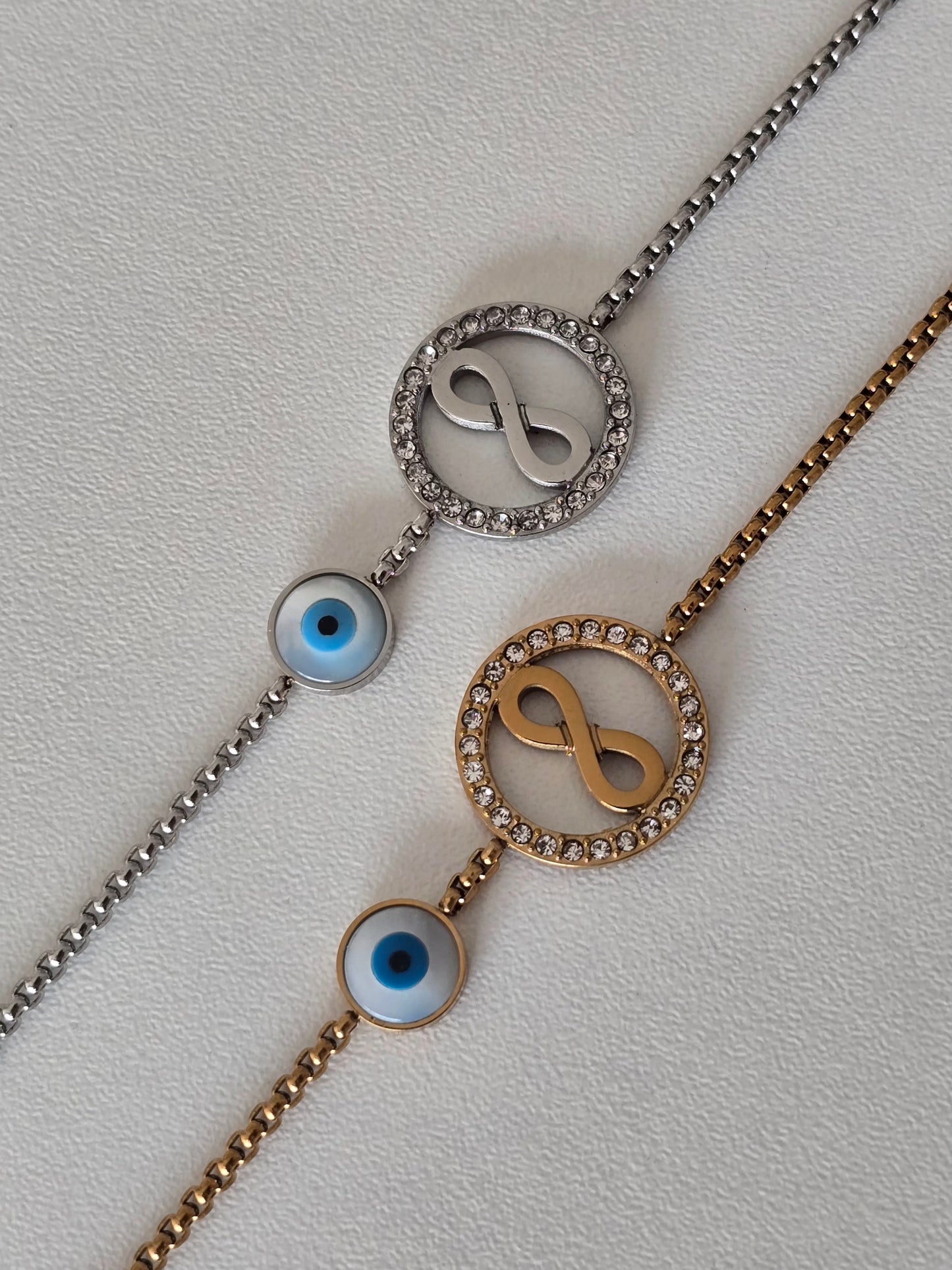 bracelet acier inoxydable argenté et doré, motif infini et oeil bleu protecteur
