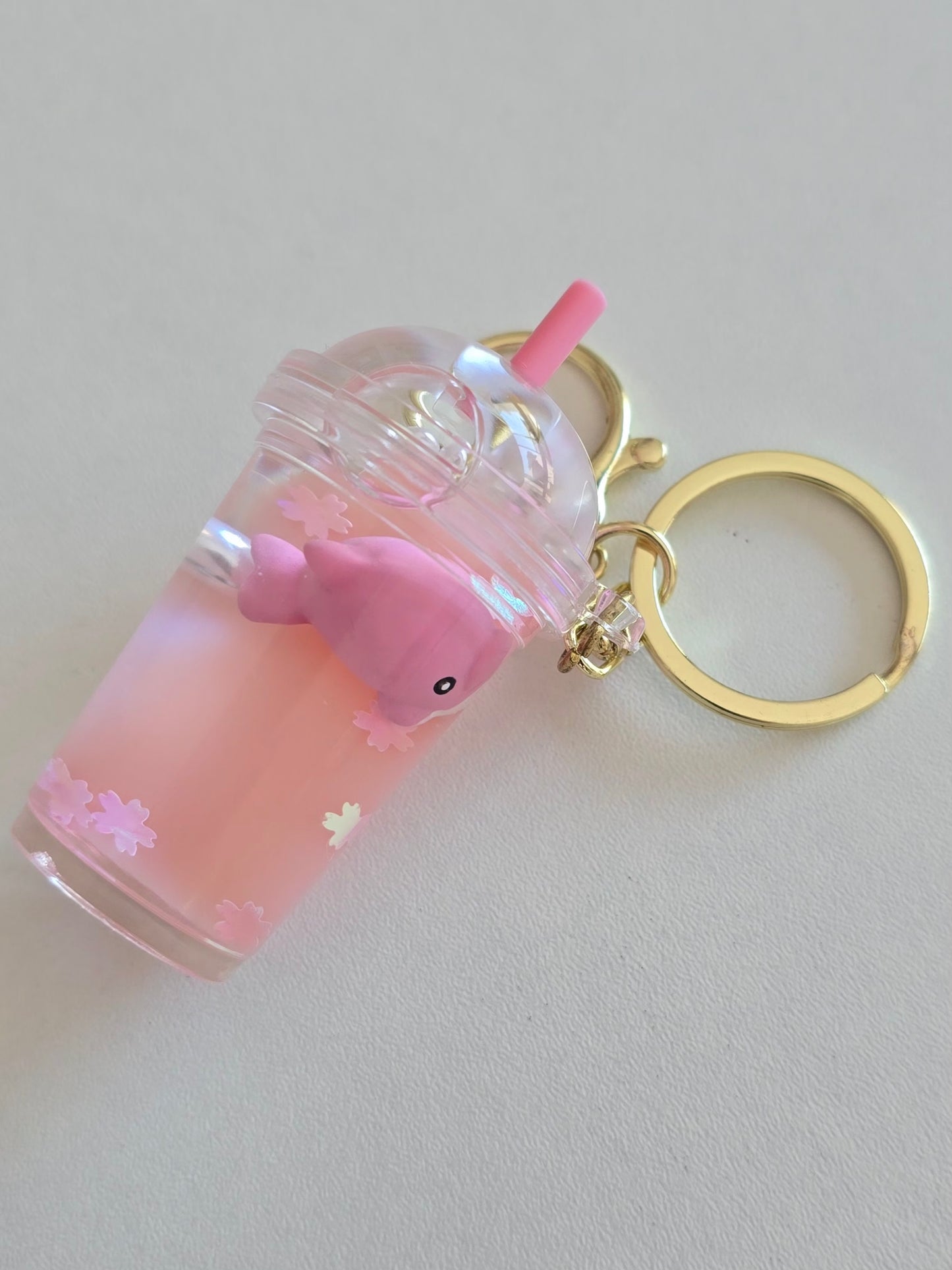porte-clé rose avec dauphin et paillettes fleurs