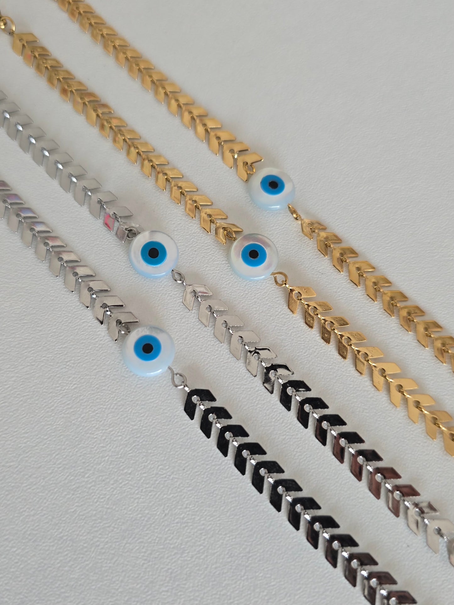 bracelet Raffiné en acier inoxydable, disponible en argenté et doré, avec oeil protecteur