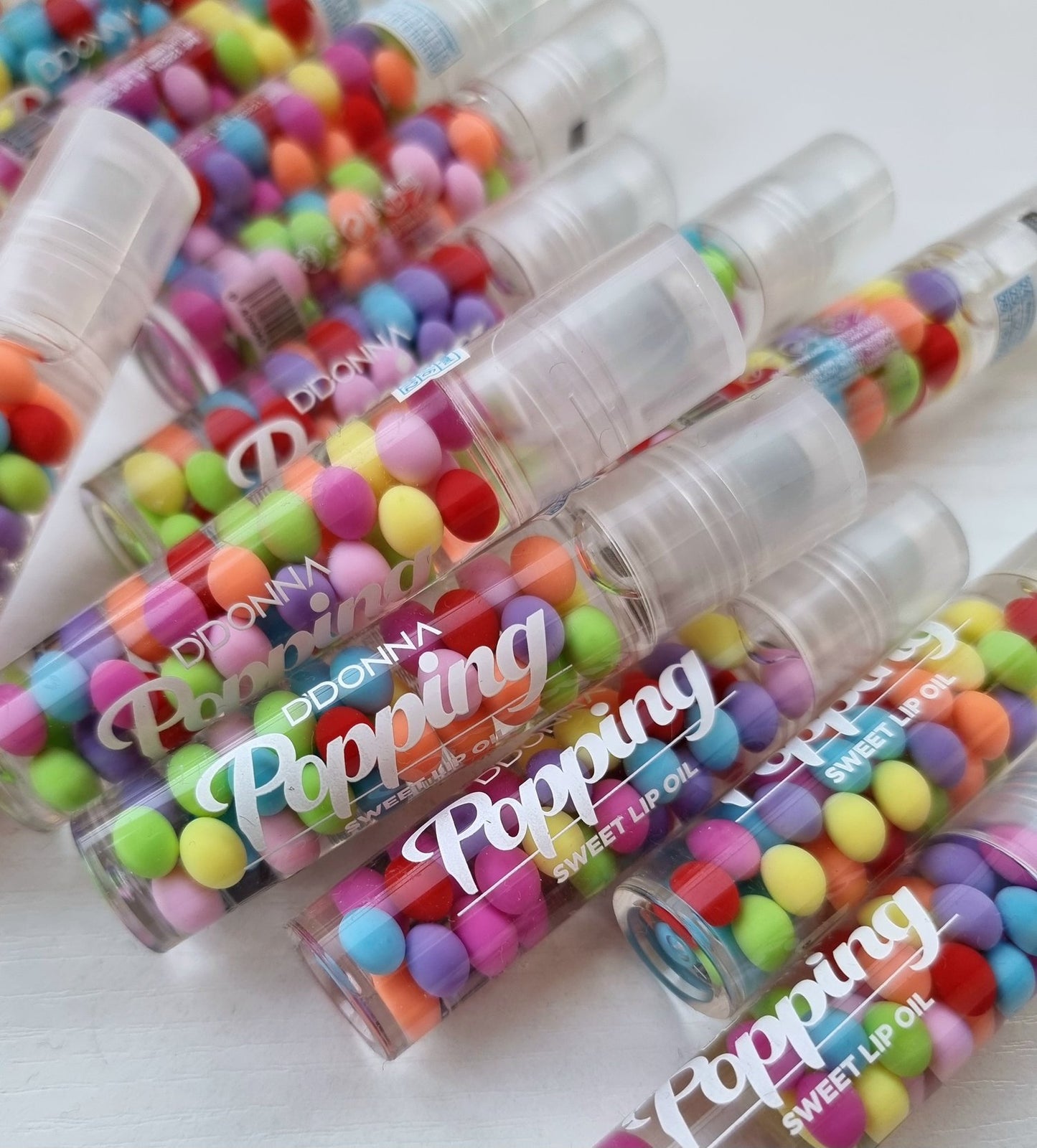 Gloss rool-on popping transparent