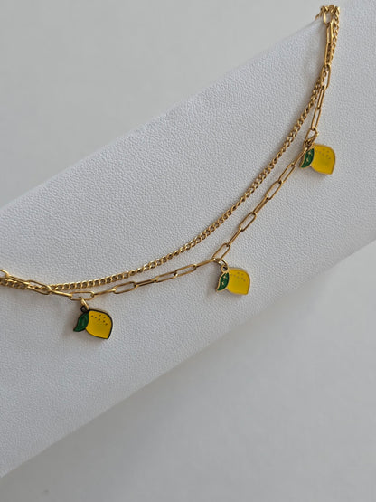 chevillier en acier inoxydable doré avec double chaîne et citrons émaillés
