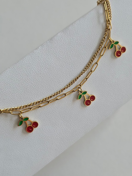 chevillier tendance en acier inoxydable doré avec cerises émaillées rouges et vertes