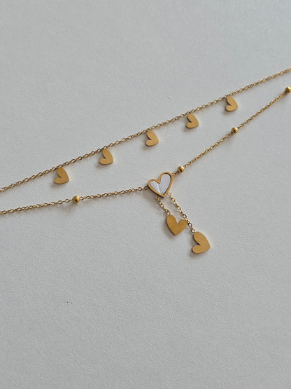 bracelet de cheville Lova en acier inoxydable doré avec double chaîne et coeur blanc irisé