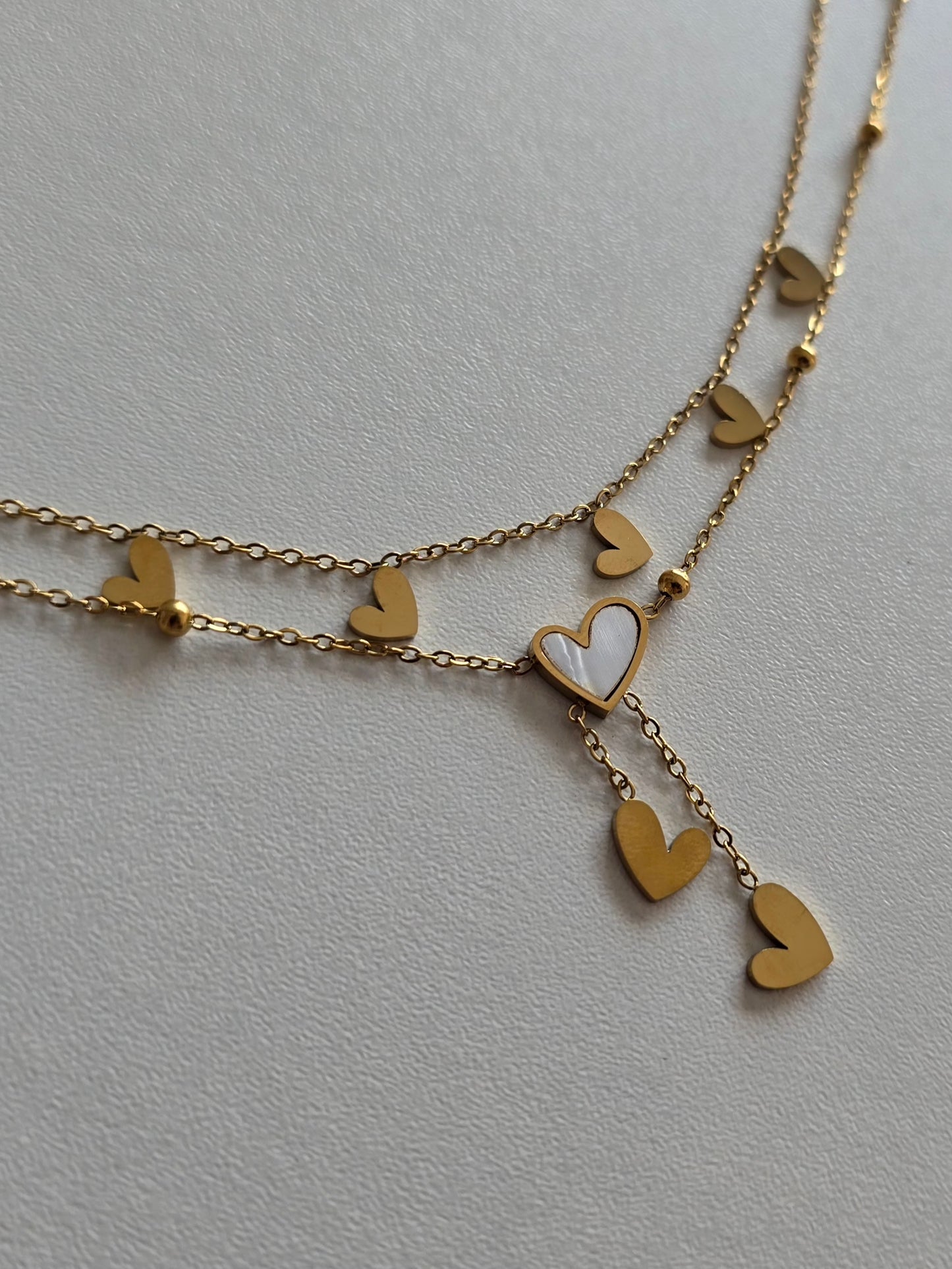 bracelet de cheville raffiné en acier inoxydable doré avec charms coeurs 