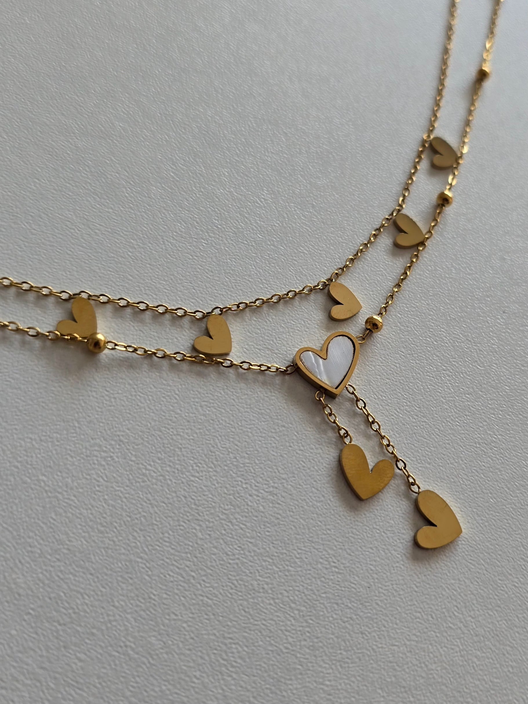 bracelet de cheville raffiné en acier inoxydable doré avec charms coeurs 