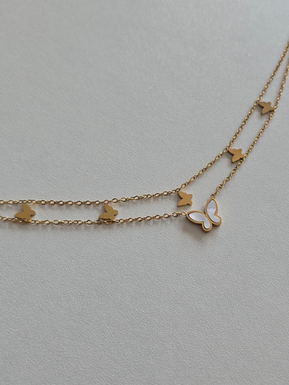 bracelet de cheville doré double chaîne avec papillons