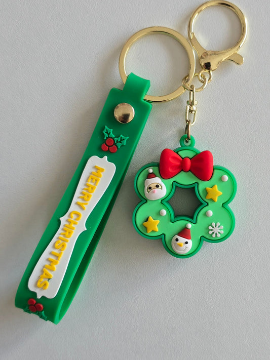 porte-clés Lumi couronne de Noël verte avec noeud rouge