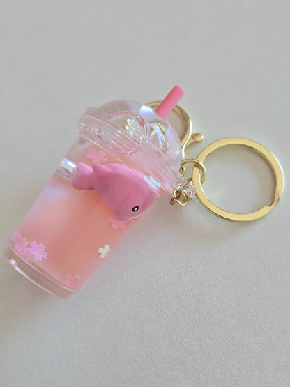 porte-clé rose avec dauphin et paillettes fleurs