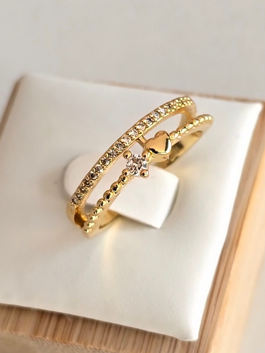 Bague Désir en acier inoxydable doré avec strass argentés et coeur