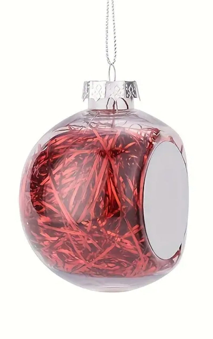 Boule de Noël personnalisée transparente avec cheveux d'ange rouges.