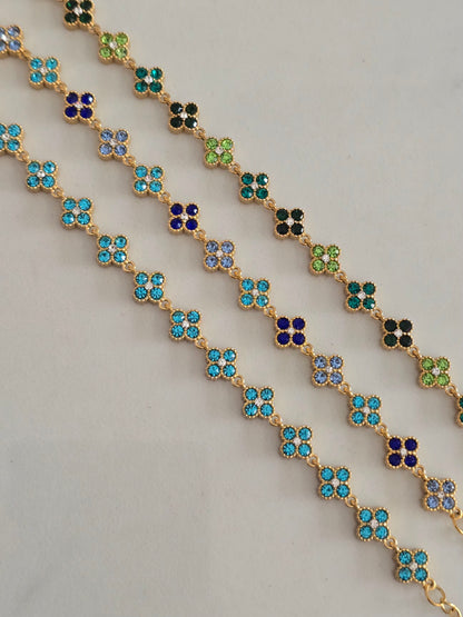 Bracelet Princesa doré avec fleurs en strass multicolores bleu, vert et turquoise