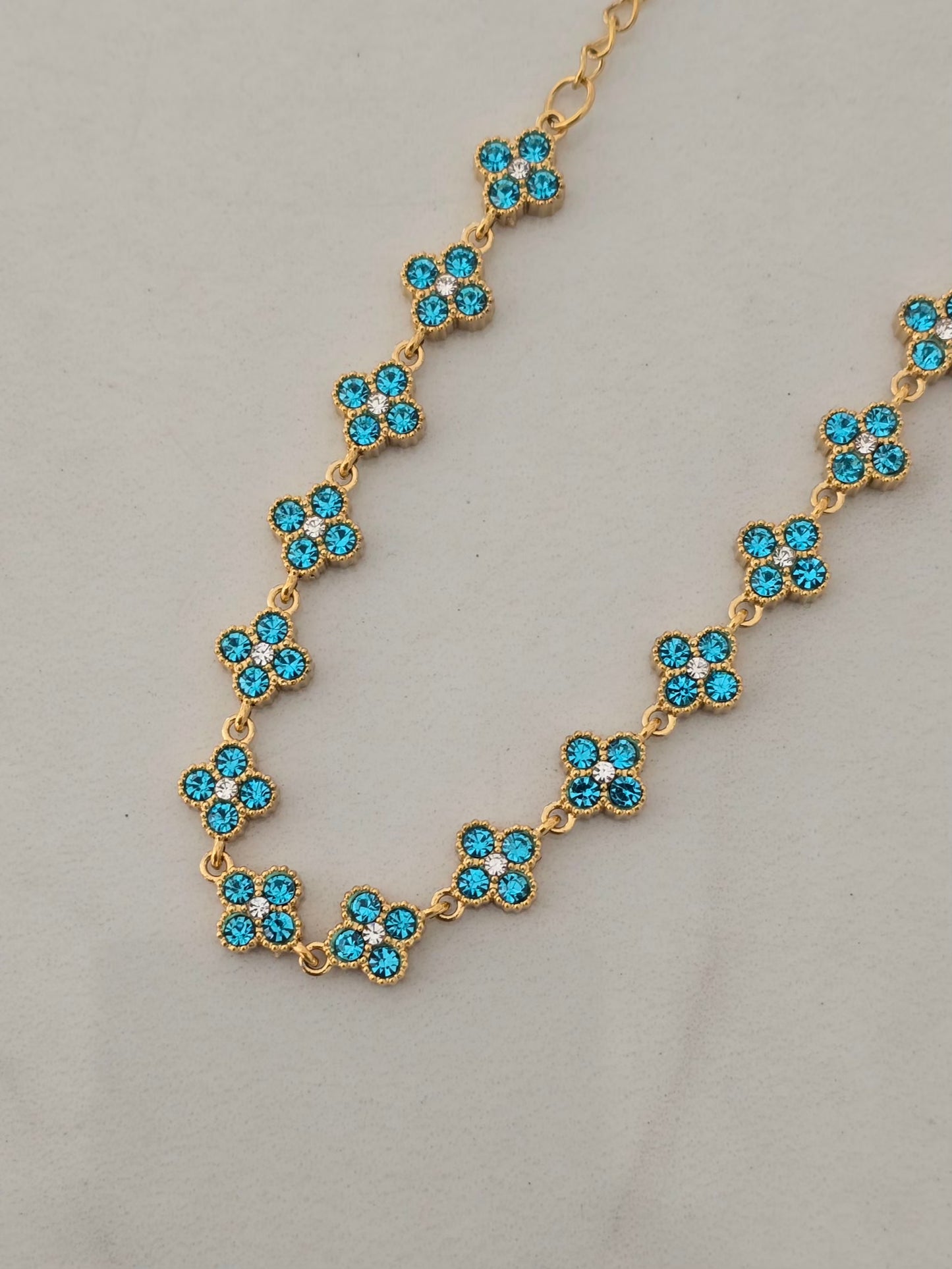 Bracelet Princesa doré avec fleurs turquoise en strass brillants