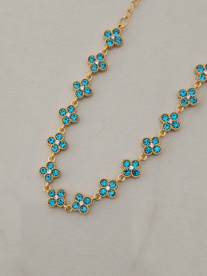Bracelet Princesa doré avec fleurs turquoise en strass brillants